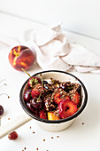 Breakfast of summer fruit with yoghurt, flax and chia