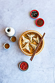 Steamed prawn dumplings with chilli oil, sambal oelek and soy Sauce