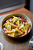 Beef and sour cherry manti with tomato-chill butter