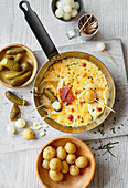 Cheese fonue with mixed pickles