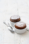 Chocolate soufflé dusted with icing sugar