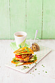 A sweet potato burger with minced beef and avocado