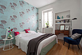 Pale blue floral wallpaper in classic bedroom