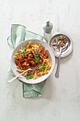 Oriental chickpea pasta with eggplant and smoked almonds