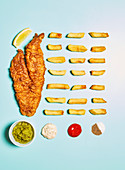Fish and chips with spices and dips