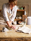 Woman kneating bread dough
