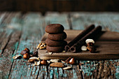 Chocolate cookies with nuts over wooden table