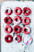 Vegan raw chocolate doughnuts with raspberry glaze