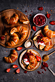 French croissants with yoghurt and strawberry rhubarb jam and honey