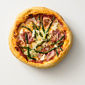 Pizza with bacon and asparagus