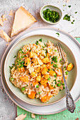 Risotto with pumpkin, chicken and green peas