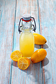 Limequat juice in a swing top bottle