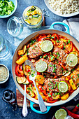 Salmon with sweet and sour sauce with oranges, pepper and coutgette