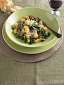 Gnocchi with mushroom and spinach sauce