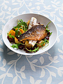 Sea bass fillets with chorizo and rocket potatoes