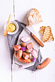 French smoked pork and shallot sausages, Dijon mustard and grilled sour dough bread