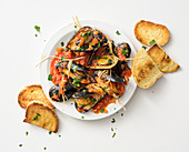 Stuffed mussels in tomato sauce