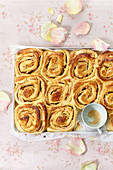 Apple and cinnamon yeast rolls on a tray