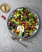 Mushroom salad with berries and poached egg