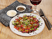Steak carpaccio with radishes, sprouts and cress