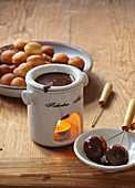 Chocolate fondue with small doughnuts