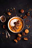 Salty caramel pudding with yoghurt and chocolate macaroons