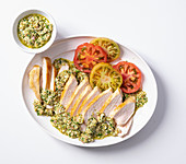Chicken breast with salsa verde and tomatoes