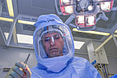 Surgeon wearing surgical hood