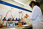 Chemistry student working in a fume cupboard