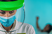 Exhausted medical worker in PPE