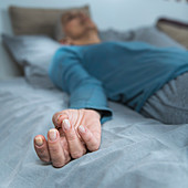 Woman lying in bed meditating