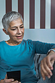 Senior woman checking smart watch sleep tracker
