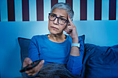 Woman with insomnia watching television