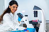 Researcher studying cell culture