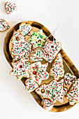 Gingerbread cookies decorated with Christmas sugar sprinkles and royal icing