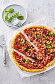Polenta pizza with corn and olives