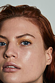 A red-haired woman wearing make-up – portrait shot