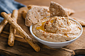 Delicious homemade hummus with paprika, seeds and olive oil