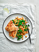 Healthy, grilled hake with smoky chickpeas, preserved lemon and kale