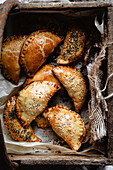 Mini empanadas into a wooden basket