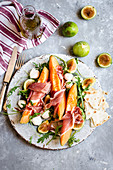 Melon and ham salad with fig and mozzarella
