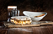 Traditional Spanish sandwich made with Iberian pork loin and cheese with fried onion