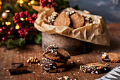Winter cookies with walnuts dipped in melted chocolate