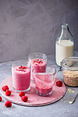 Drinking raspberry yoghurt with oats and vanilla