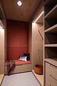 Couch in walk-in wardrobe with lighting