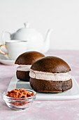 Chocolate buns with natural dried strawberry powder cream