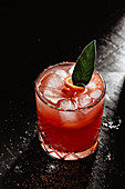 Orange cocktail with sage leaf