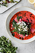 Beet soup with feta cheese and herbs