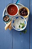 Tomato dip, mint yogurt, olives and pistachios