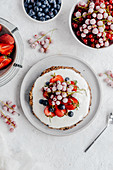 Cream tart with strawberries, currants and blueberries
